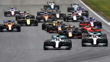 NORTHAMPTON, ENGLAND - JULY 14: Valtteri Bottas driving the (77) Mercedes AMG Petronas F1 Team Mercedes W10 leads Lewis Hamilton of Great Britain driving the (44) Mercedes AMG Petronas F1 Team Mercedes W10 into turn one at the start during the F1 Grand Prix of Great Britain at Silverstone on July 14, 2019 in Northampton, England. (Photo by Mark Thompson/Getty Images)