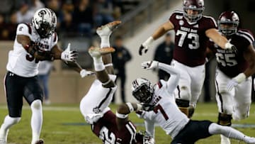 COLLEGE STATION, TEXAS - NOVEMBER 16: Cordarrian Richardson #25 of the Texas A&M Aggies is upended by Jammie Robinson #7 of the South Carolina Gamecocks as Ernest Jones #53 looks on during their game at Kyle Field on November 16, 2019 in College Station, Texas. (Photo by Bob Levey/Getty Images)