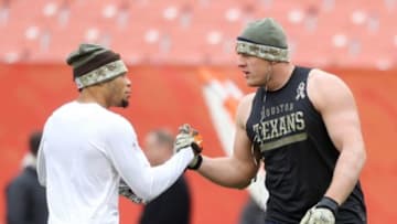 Nov 16, 2014; Cleveland, OH, USA; Cleveland Browns cornerback Joe Haden (23) and Houston Texans defensive end J.J. Watt (99) shake hands before a game against at FirstEnergy Stadium. Mandatory Credit: Ron Schwane-USA TODAY Sports