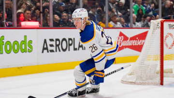 Mar 20, 2022; Vancouver, British Columbia, CAN; Buffalo Sabres defenseman Rasmus Dahlin (26) celebrates his game winning goal against the Vancouver Canucks at Rogers Arena. Sabres won 3-2 in overtime. Mandatory Credit: Bob Frid-USA TODAY Sports
