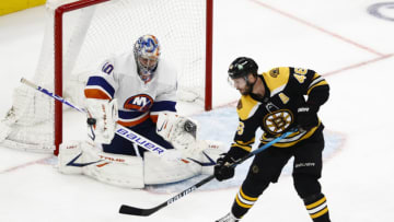 Jun 7, 2021; Boston, Massachusetts, USA; New York Islanders goaltender Semyon Varlamov (40) makes a save with Boston Bruins center David Krejci (46) standing in front during the second period of game five of the second round of the 2021 Stanley Cup Playoffs at TD Garden. Mandatory Credit: Winslow Townson-USA TODAY Sports