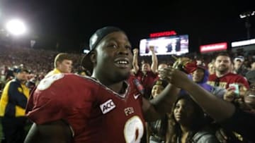 Jan 6, 2014; Pasadena, CA, USA; Florida State Seminoles defensive tackle Timmy Jernigan (8) celebrates after defeating the Auburn Tigers 34-31 the 2014 BCS National Championship game at the Rose Bowl. Mandatory Credit: Matthew Emmons-USA TODAY Sports