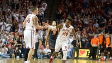 Feb 24, 2016; Norman, OK, USA; Oklahoma Sooners guard Buddy Hield (24) congratulates forward Ryan Spangler (00) after a made 3 point shot against the Oklahoma State Cowboy at the end of the first half at Lloyd Noble Center. Mandatory Credit: Mark D. Smith-USA TODAY Sports