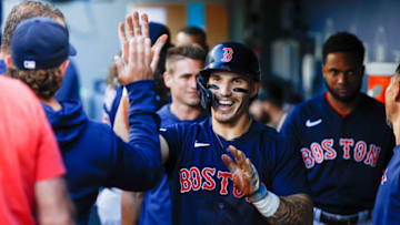 Jul 31, 2023; Seattle, Washington, USA; Boston Red Sox center fielder Jarren Duran (16) high-fives teammates after scoring a run on two throwing errors by the Seattle Mariners during the first inning at T-Mobile Park. Mandatory Credit: Joe Nicholson-USA TODAY Sports