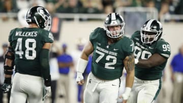 EAST LANSING, MI - AUGUST 30: Mike Panasiuk #72 of the Michigan State Spartans celebrates after a tackle behind the line of scrimmage in the third quarter against the Tulsa Golden Hurricane at Spartan Stadium on August 30, 2019 in East Lansing, Michigan. (Photo by Joe Robbins/Getty Images)