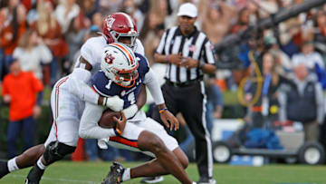 Auburn footballNov 27, 2021; Auburn, Alabama, USA; Auburn Tigers quarterback TJ Finley (1) is tackled by Alabama Crimson Tide linebacker Will Anderson Jr. (31) during the first quarter at Jordan-Hare Stadium. Mandatory Credit: John Reed-USA TODAY Sports