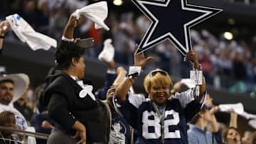 Jan 4, 2015; Arlington, TX, USA; Dallas Cowboys fans cheer during the fourth quarter against the Detroit Lions in the NFC Wild Card Playoff Game at AT&T Stadium. Mandatory Credit: Matthew Emmons-USA TODAY Sports