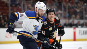 ANAHEIM, CALIFORNIA - MARCH 06: Carter Rowney #24 of the Anaheim Ducks pushes Joel Edmundson #6 of the St. Louis Blues during the first period of a game at Honda Center on March 06, 2019 in Anaheim, California. (Photo by Sean M. Haffey/Getty Images)