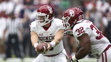 Sep 3, 2016; Houston, TX, USA; Oklahoma Sooners quarterback Baker Mayfield (6) hands off to running back Samaje Perine (32) during the game against the Houston Cougars at NRG Stadium. Mandatory Credit: Troy Taormina-USA TODAY Sports
