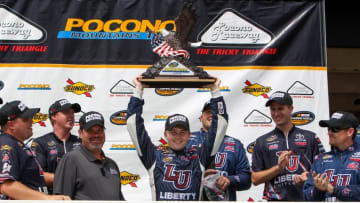 Jul 30, 2016; Long Pond, PA, USA; NASCAR Camping World Truck Series driver William Byron raises the trophy in victory lane after winning the Pocono Mountains 150 at Pocono Raceway. Mandatory Credit: Matthew O