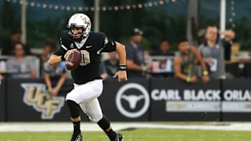 ORLANDO, FL - SEPTEMBER 08: McKenzie Milton #10 of the UCF Knights runs with the ball during a football game against the South Carolina State Bulldogs at Spectrum Stadium on September 8, 2018 in Orlando, Florida. (Photo by Alex Menendez/Getty Images)