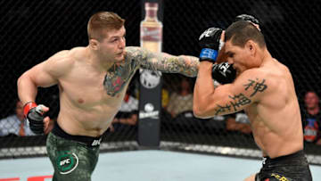 SACRAMENTO, CALIFORNIA - JULY 13: (L-R) Marvin Vettori of Italy punches Cezar Ferreira of Brazil in their middleweight bout during the UFC Fight Night event at Golden 1 Center on July 13, 2019 in Sacramento, California. (Photo by Jeff Bottari/Zuffa LLC/Zuffa LLC via Getty Images)