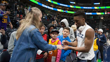 SALT LAKE CITY, UT - DECEMBER 25: Donovan Mitchell #45 of the Utah Jazz signs autographs for fans during warmups before their game against the Portland Trail Blazers at the Vivint Smart Home Arena on December 25, 2018 in Salt Lake City , Utah. NOTE TO USER: User expressly acknowledges and agrees that, by downloading and or using this photograph, User is consenting to the terms and conditions of the Getty Images License Agreement. (Photo by Chris Gardner/Getty Images)