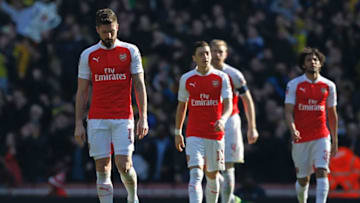 (L-R) Arsenal's French striker Olivier Giroud, Arsenal's German midfielder Mesut Ozil, Arsenal's German defender Per Mertesacker and Arsenal's Egyptian midfielder Mohamed Elneny reacts after conceding the opening goal during the FA Cup quarter final football match between Arsenal and Watford at the Emirates Stadium in London on March 13, 2016. / AFP / Ian Kington / RESTRICTED TO EDITORIAL USE. No use with unauthorized audio, video, data, fixture lists, club/league logos or 'live' services. Online in-match use limited to 75 images, no video emulation. No use in betting, games or single club/league/player publications. / (Photo credit should read IAN KINGTON/AFP/Getty Images)