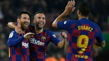 Barcelona's Argentine forward Lionel Messi (L) celebrates his goal with Barcelona's Spanish defender Jordi Alba and Barcelona's Uruguayan forward Luis Suarez. (Photo by LLUIS GENE/AFP via Getty Images)