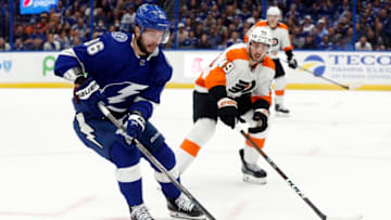 Oct 18, 2022; Tampa, Florida, USA; Tampa Bay Lightning right wing Nikita Kucherov (86) skates with the puck as Philadelphia Flyers left wing Noah Cates (49) defends during the first period at Amalie Arena. Mandatory Credit: Kim Klement-USA TODAY Sports