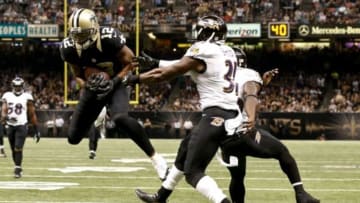 Nov 24, 2014; New Orleans, LA, USA; New Orleans Saints wide receiver Marques Colston (12) catches a 26 yard touchdown past Baltimore Ravens free safety Terrence Brooks (31) and strong safety Matt Elam (26) during the second quarter of a game at the Mercedes-Benz Superdome. Mandatory Credit: Derick E. Hingle-USA TODAY Sports
