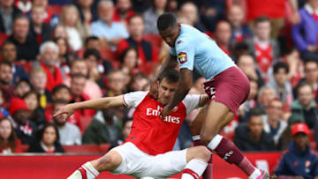 LONDON, ENGLAND - SEPTEMBER 22: Sokratis Papastathopoulos of Arsenal battles for possession with Wesley of Aston Villa during the Premier League match between Arsenal FC and Aston Villa at Emirates Stadium on September 22, 2019 in London, United Kingdom. (Photo by Michael Steele/Getty Images)