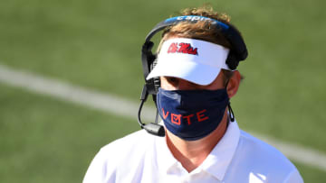 Oct 31, 2020; Nashville, Tennessee, USA; Mississippi Rebels head coach Lane Kiffin wears a mask with the word vote printed on the front during the first half against the Vanderbilt Commodores at Vanderbilt Stadium. Mandatory Credit: Christopher Hanewinckel-USA TODAY Sports
