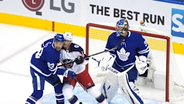 Cody Ceci #83 of the Toronto Maple Leafs shoves Gustav Nyquist #14 of the Columbus Blue Jackets. (Photo by Andre Ringuette/Freestyle Photo/Getty Images)
