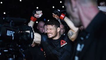 Oct 8, 2016; Manchester, UK; Michael Bisping (red gloves) enters the arena before his fight against Dan Henderson (blue gloves) during UFC 204 at Manchester Arena. Mandatory Credit: Per Haljestam-USA TODAY Sports