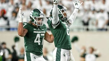 Michigan State's Quavaris Crouch, right, celebrates his sack against Nebraska with teammate Jackson Morse TE Jeff Pietrowski during the first quarter on Saturday, Sept. 25, 2021, at Spartan Stadium in East Lansing.210925 Msu Nebraska 111a