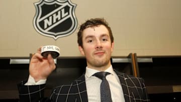 ST. PAUL, MN - APRIL 04: Zach Senyshyn #19 of the Boston Bruins holds the puck from his 1st NHL goal an empty netter in the 3rd period during a game with the Minnesota Wild at Xcel Energy Center on April 4, 2019 in St. Paul, Minnesota.(Photo by Bruce Kluckhohn/NHLI via Getty Images)