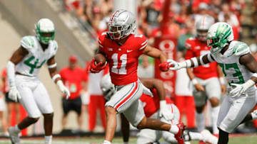 Ohio State Buckeyes wide receiver Jaxon Smith-Njigba (11) runs ahead of Oregon Ducks safety Verone McKinley III (23) after making a catch during the first half of the NCAA football game at Ohio Stadium in Columbus on Saturday, Sept. 11, 2021.Oregon Ducks At Ohio State Buckeyes Football