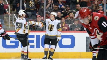 GLENDALE, AZ - NOVEMBER 25: Jonathan Marchessault #81 of the Vegas Golden Knights is congratulated by teammate William Karlsson #71 after his empty net goal against the Arizona Coyotes during the third period at Gila River Arena on November 25, 2017 in Glendale, Arizona. (Photo by Norm Hall/NHLI via Getty Images)