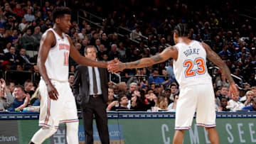 NEW YORK, NY - MARCH 23: Frank Ntilikina #11 and Trey Burke #23 of the New York Knicks high five during the game against the Minnesota Timberwolves on March 23, 2018 at Madison Square Garden in New York City, New York. Copyright 2018 NBAE (Photo by Nathaniel S. Butler/NBAE via Getty Images)