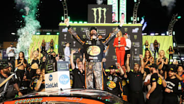 HOMESTEAD, FL - NOVEMBER 19: Martin Truex Jr., driver of the #78 Bass Pro Shops/Tracker Boats Toyota, celebrates in Victory Lane after winning the Monster Energy NASCAR Cup Series Championship and the Monster Energy NASCAR Cup Series Championship Ford EcoBoost 400 at Homestead-Miami Speedway on November 19, 2017 in Homestead, Florida. (Photo by Chris Graythen/Getty Images)