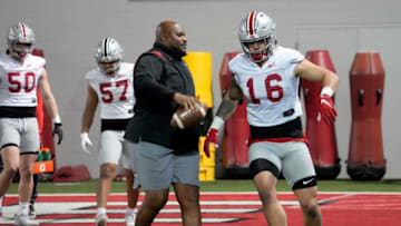 Defensive line coach Larry Johnson works with Cade Stover (16) during the first practice of spring football for Ohio State University at the Woody Hayes Athletic Center in Columbus on Tuesday, March 8, 2022.Ceb Osufb Spring 0308 Bjp 35