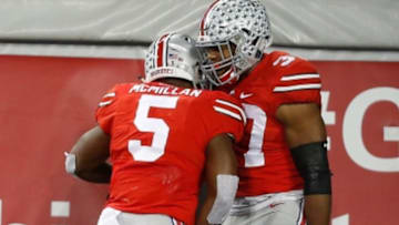 Nov 7, 2015; Columbus, OH, USA; Ohio State Buckeyes linebacker Joshua Perry (37) celebrates with teammate Raekwon McMillan (5) following the Von bell interception return for touchdown versus the Minnesota Golden Gophers at Ohio Stadium. Ohio State won the game 28-14. Mandatory Credit: Joe Maiorana-USA TODAY Sports