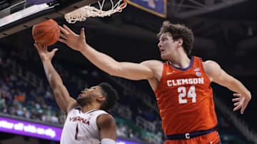 Mar 10, 2023; Greensboro, NC, USA; Virginia Cavaliers forward Jayden Gardner (1) shoots as Clemson Tigers center PJ Hall (24) defends in the second half during the semifinals of the ACC Tournament at Greensboro Coliseum. Mandatory Credit: Bob Donnan-USA TODAY Sports