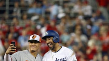 WASHINGTON, DC - JULY 17: Manny Machado #13 of the Baltimore Orioles and the American League and Matt Kemp #27 of the Los Angeles Dodgers and the National League pose for a selfie in the second inning during the 89th MLB All-Star Game, presented by Mastercard at Nationals Park on July 17, 2018 in Washington, DC. (Photo by Patrick Smith/Getty Images)