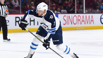 MONTREAL, QC - APRIL 03: Winnipeg Jets Defenceman Ben Chiarot (7) shoots the puck during the Winnipeg Jets versus the Montreal Canadiens game on April 3, 2018, at Bell Centre in Montreal, QC (Photo by David Kirouac/Icon Sportswire via Getty Images)