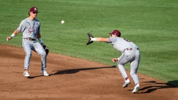 Jun 20, 2021; Omaha, Nebraska, USA; Mississippi State Bulldogs infielder Scott Dubrule (3) catches an infield fly as infielder Lane Forsythe (43) looks on in the first inning against the Texas Longhorns at TD Ameritrade Park. Mandatory Credit: Steven Branscombe-USA TODAY Sports