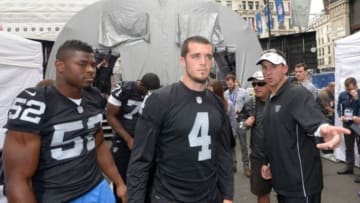 Sep 27, 2014; London, UNITED KINGDOM; Oakland Raiders linebacker Khalil Mack (52), quarterback Derek Carr (4) and coach Dennis Allen at NFL on Regent Street in advance of the International Series game between the Miami Dolphins and the Raiders. Mandatory Credit: Kirby Lee-USA TODAY Sports