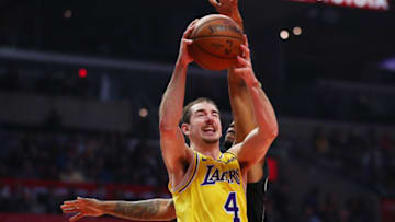 LOS ANGELES, CALIFORNIA - APRIL 05: Alex Caruso #4 of the Los Angeles Lakers drives to the basket against Tyrone Wallace #9 of the Los Angeles Clippers during the first half at Staples Center on April 05, 2019 in Los Angeles, California. NOTE TO USER: User expressly acknowledges and agrees that, by downloading and or using this photograph, User is consenting to the terms and conditions of the Getty Images License Agreement. (Photo by Yong Teck Lim/Getty Images)