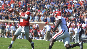 Sep 24, 2016; Oxford, MS, USA; Mississippi Rebels quarterback Chad Kelly (10) drops back to pass under pressure from Georgia Bulldogs linebacker Roquan Smith (3) during the first quarter of the game at Vaught-Hemingway Stadium. Mandatory Credit: Matt Bush-USA TODAY Sports