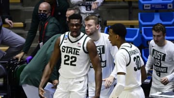 Mar 18, 2021; West Lafayette, Indiana, USA; Michigan State Spartans center Mady Sissoko (22) reacts on the bench in the first half during the First Four of the 2021 NCAA Tournament at Mackey Arena. Mandatory Credit: Marc Lebryk-USA TODAY Sports