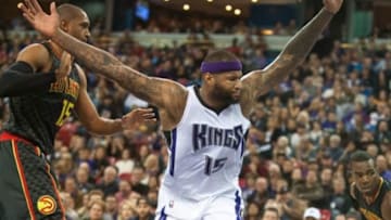 Jan 21, 2016; Sacramento, CA, USA; Sacramento Kings center DeMarcus Cousins (15) reacts after being fouled by Atlanta Hawks center Al Horford (15) during the second quarter at Sleep Train Arena. Mandatory Credit: Ed Szczepanski-USA TODAY Sports