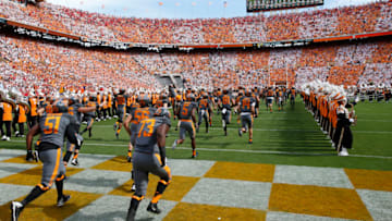 KNOXVILLE, TN - SEPTEMBER 30: Tennessee Volunteers players run through the "T" made by the marching band as they take the field before a game against the Georgia Bulldogs at Neyland Stadium on September 30, 2017 in Knoxville, Tennessee. Georgia won 41-0. (Photo by Joe Robbins/Getty Images) *** Local Caption ***