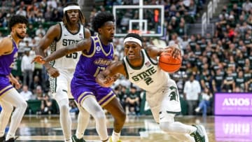 Michigan State's Tyson Walker, right, moves past James Madison's Michael Green III during the second half on Monday, Nov. 6, 2023, in East Lansing.