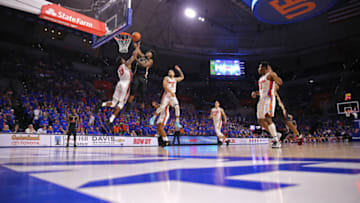 GAINESVILLE, FL - DECEMBER 04: Terance Mann #14 of the Florida State Seminoles scores in front of Kevarrius Hayes #13 and Chris Chiozza #11 of the Florida Gators during a NCAA basketball game at the Stephen C. O' Connell Center on December 4, 2017 in Gainesville, Florida. (Photo by Alex Menendez/Getty Images)