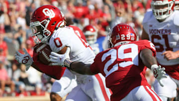 Apr 24, 2021; Norman, Oklahoma, USA; Oklahoma Sooners running back Eric Gray (0) runs for a touchdown past Oklahoma Sooners safety Jordan Mukes (29) during the spring game at Gaylord Family-Oklahoma Memorial Stadium. Mandatory Credit: Kevin Jairaj-USA TODAY Sports