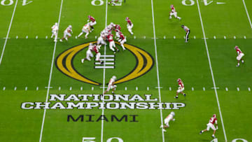 MIAMI GARDENS, FL - JANUARY 11: Master Teague III #33 of the Ohio State Buckeyes rushes against the Alabama Crimson Tide during the College Football Playoff National Championship held at Hard Rock Stadium on January 11, 2021 in Miami Gardens, Florida. (Photo by Jamie Schwaberow/Getty Images)