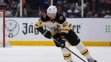 Jun 5, 2021; Uniondale, New York, USA; Boston Bruins center Brad Marchand (63) skates with the puck against the New York Islanders during the first period in game four of the second round of the 2021 Stanley Cup Playoffs at Nassau Veterans Memorial Coliseum. Mandatory Credit: Dennis Schneidler-USA TODAY Sports