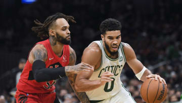 Oct 9, 2021; Boston, Massachusetts, USA; Boston Celtics forward Jayson Tatum (0) drives to the basket while Toronto Raptors guard Gary Trent Jr. (33) defends during the second half at TD Garden. Mandatory Credit: Bob DeChiara-USA TODAY Sports