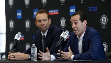 May 16, 2016; Brooklyn, NY, USA; Brooklyn Nets general manager Sean Marks listens to Brooklyn Nets new head coach Kenny Atkinson answer questions from media during press conference at HSS Training Center. Mandatory Credit: Noah K. Murray-USA TODAY Sports
